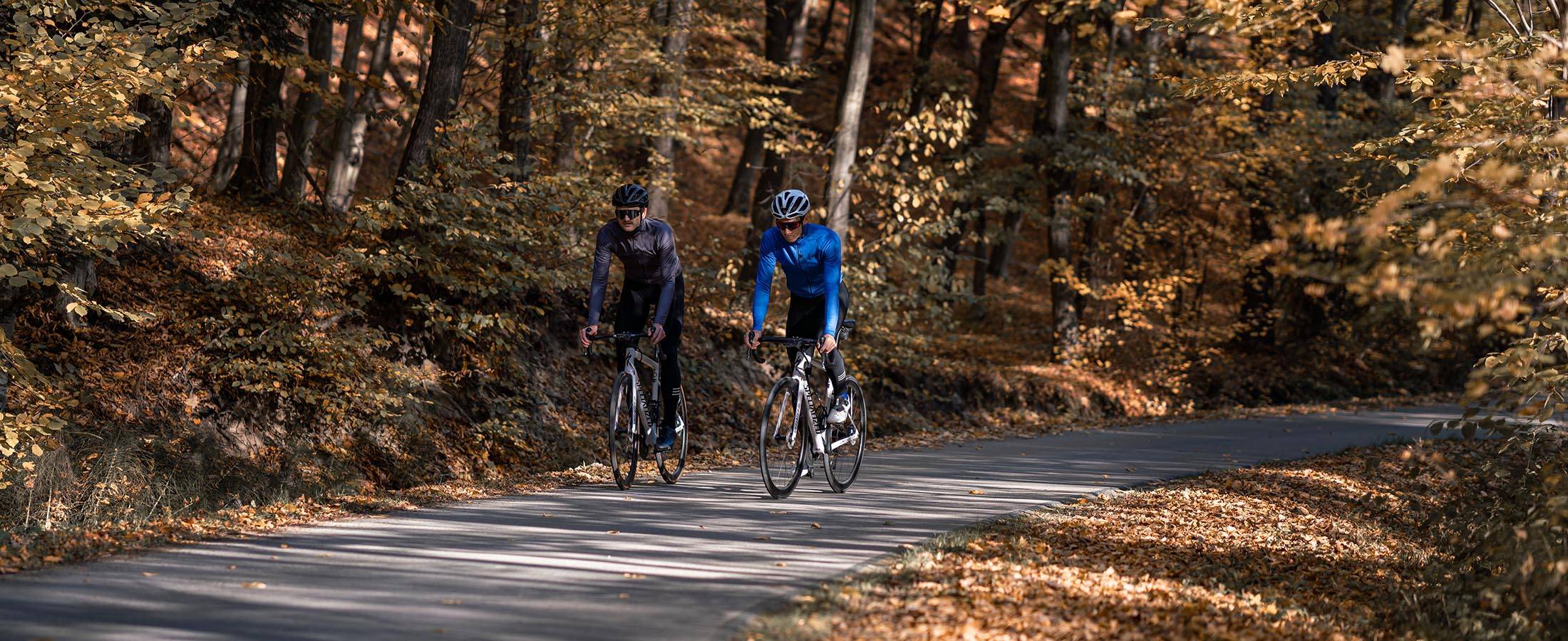 two guys are riding in Tarnawka forest in Poland and wearing Luxa autumn premium clothing